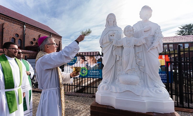 A 100-year milestone. Sydney Bishop Daniel Meagher blesses Holy Family Maroubra's new statue of its patrons last weekend. Photo: Patrick J. Lee