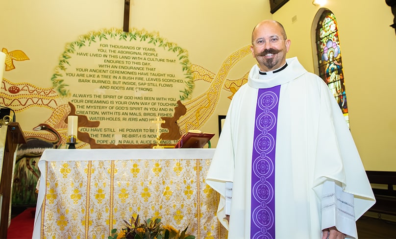 Father Paul Smithers of Sydney City South Parish proudly models the vestments for the celebration of Mass he commissioned at St Vincent’s Church in Redfern. Photo: Giovanni Portelli
