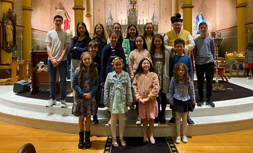 Pope Francis students and siblings with Fr Victor.
