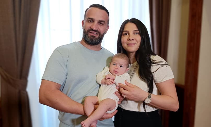 Danny and Leila Abdallah pose for a photo with 3-month-old Selina at the Domus Australia in Rome on 24 June. Photo: CNS, Robert Duncan