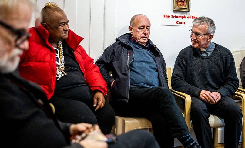 Sydney Bishop Daniel Meagher, at right, chats with visitors to David’s Place. Photo: Alphonsus Fok