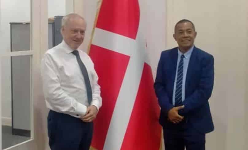 Standing on either side of the flag of the Order of Malta, the Ambassador to Timor Leste, Terry Tobin QC, at left, stands with the nation’s Minister of Justice Tiago Amaral Sarmento in the Order’s’ embassy in Dili.