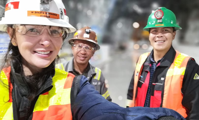 Dr Kathleen Turner and fellow workers smile for the camera nearly two kilometres underground in the Grasberg mine in Papua, Indonesia. Photo: Supplied