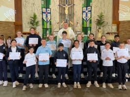 St Luke’s Revesby students with their Certificates from the Winter Sleep Out. Photo: Supplied
