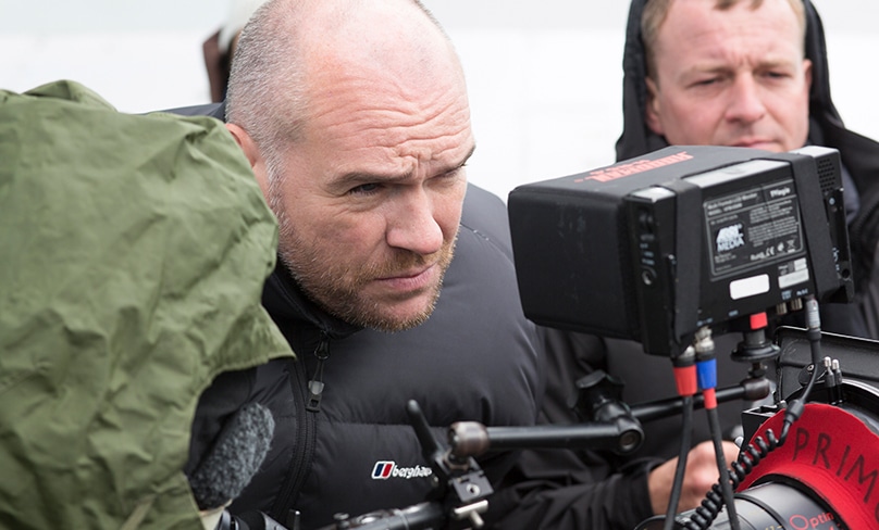 irector John Michael McDonagh imonitors shooting on the 2014 movie Calvary. Photo: CNS, 20th Century Fox