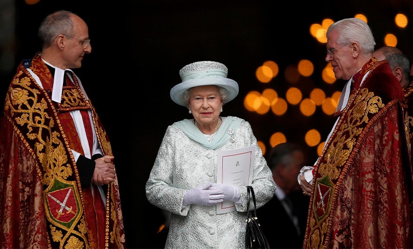 Britain's Queen Elizabeth II smiles as she leaves St. Paul's Cathedral with the Revs. David Ison and Michael Colclough following a thanksgiving service to mark her diamond jubilee in London June 5, 2012. Photo: CNS photo/Andrew Winning, Reuters