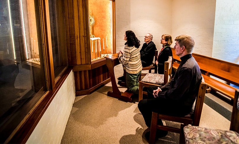 Father Doug Harris, Fr Hugh Thomas CSsr, Michelle Firth and Vivien Watts pray in the new Perpetual Adoration Chapel at Rooty Hill parish. Photo: Giovanni Portelli