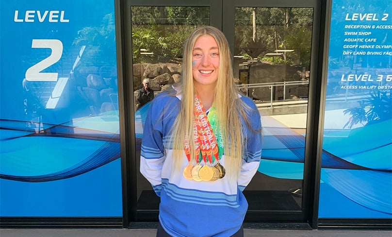 Tameeka proudly displays her medals at the School Sport Australia Swimming Championships in Brisbane. Photo: Supplied