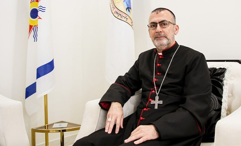 Archbishop Amel Shamon Nona, head of the Chaldean Catholic Eparchy of St Thomas the Apostle, sits at home in Sydney during an interview with The Catholic Weekly. Photo: Adam Wesselinoff