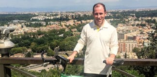 Have bike, will ride: Fr Thomas Casanova with his bicycle on a hill above Rome.