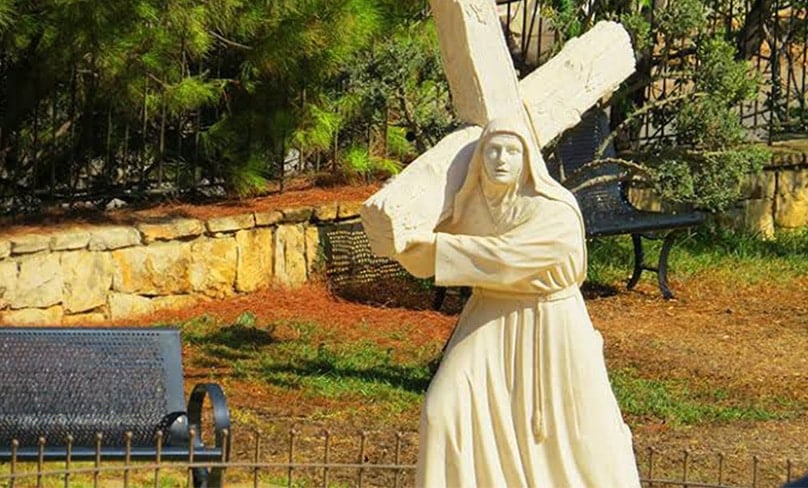 A statue of St Rafqa, known among Maronite Christians as the Lover of the Cross, is depicted carrying the cross of her own sufferings through life. Photo: supplied