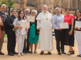 Together they equal 200 years of married bliss: they are, left to right, Helen and Alistair McKenzie (50 years), Annie and Ramon Coloma (50 years), Laura and Joseph Andary (50 years), Archbishop Anthony Fisher OP, Maria and Frank Failla (30 years) and Brenda and John Clarke (20 years). The couples were among the 150 or so representing 1400 years of marriage at last weekend’s Mass. Photo: Giovanni Portelli