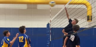 Sutherland (dark blue) take on Cronulla (blue and yellow) in the Senior Boys Volleyball match. Photo: Supplied