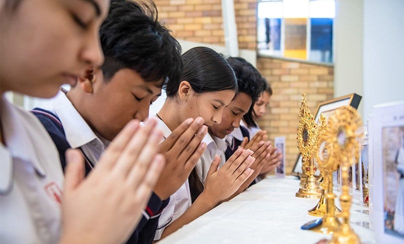Students from Trinity College in Auburn and St Peter Chanel Primary at Regent’s Park were introduced to relics of some of the great saints this week. Photo: Alphonsus Fok