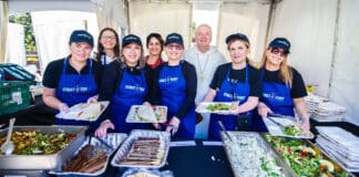Sydney’s Annual Street Feast brought together charitable organisations and the people they serve for a relaxed afternoon of good food and live music at St Mary’s Cathedral forecourt. Fr Peter Smith, inset at left, hopes the event will spread further afield. Photo: Giovanni Portelli
