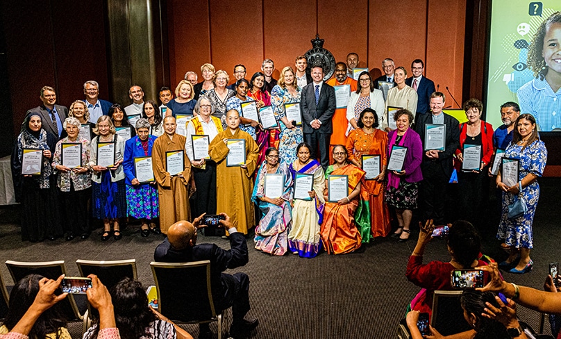 Recipients pose for the camera with their awards for Outstanding Service to Special Religious Education (SRE) and to the Community during COVID. Photo: Alphonsus Fok