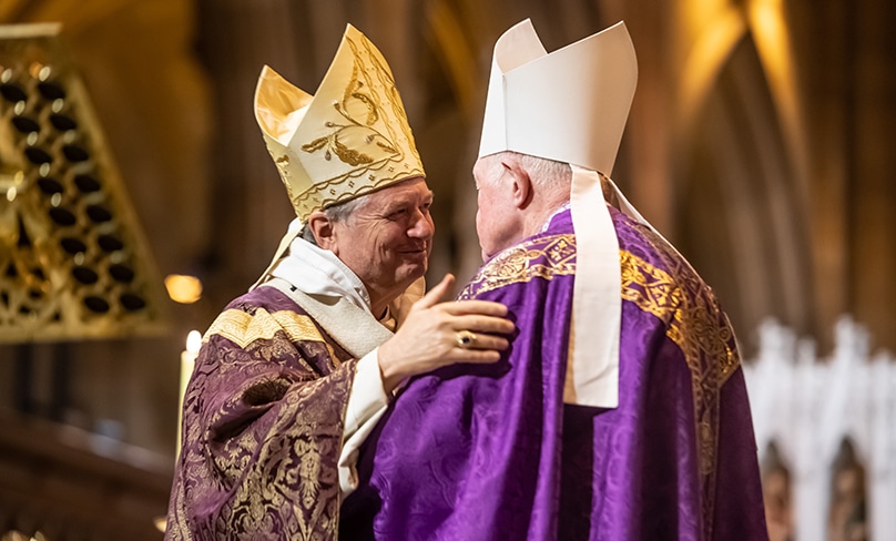 Brothers: Archbishop Anthony Fisher OP, left, embraces Bishop Terence Brady at the auxiliary bishop’s farewell Mass on 9 December. Photo: Giovanni Portelli