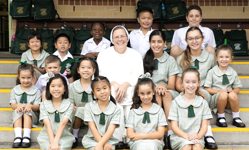 Sr Cecilia Joseph with young students at St Peter Chanel Primary in Regents Park. Photo: St Peter Chanel Primary, Regents Park