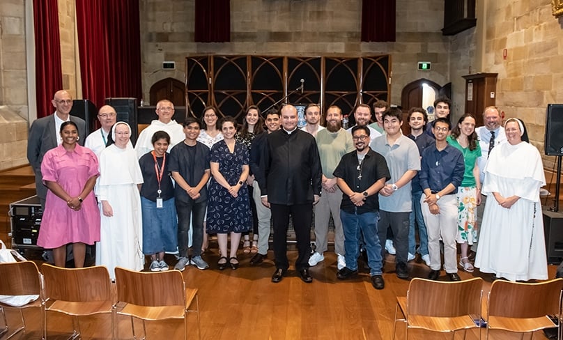 A group of university staff, clergy, chaplains &amp; students with Fr Raymond at Chapter Hall on 7 February. Photo: Giovanni Portelli