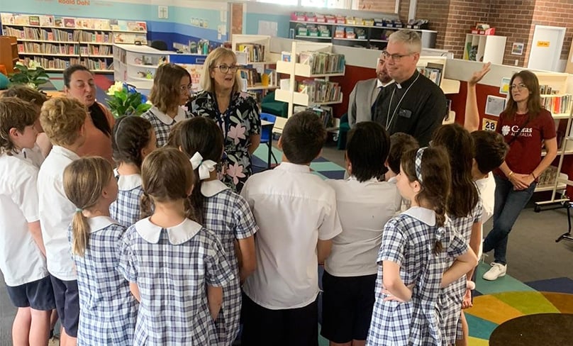 Bishop Umbers and Ms Chehide with students at Gallilee Primary School in Bondi. Photo: Supplied