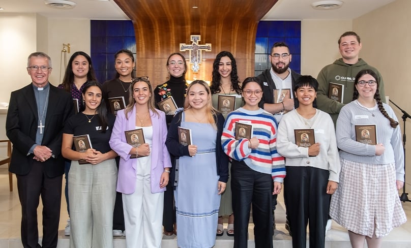 Bishop Daniel Meagher with 12 of the young catechists commissioned at the Polding Centre on 21 March. Photo: Giovanni Portelli