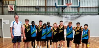 The boys Mackillop team with SCS students wearing “Sydney” jerseys. Photo: Supplied