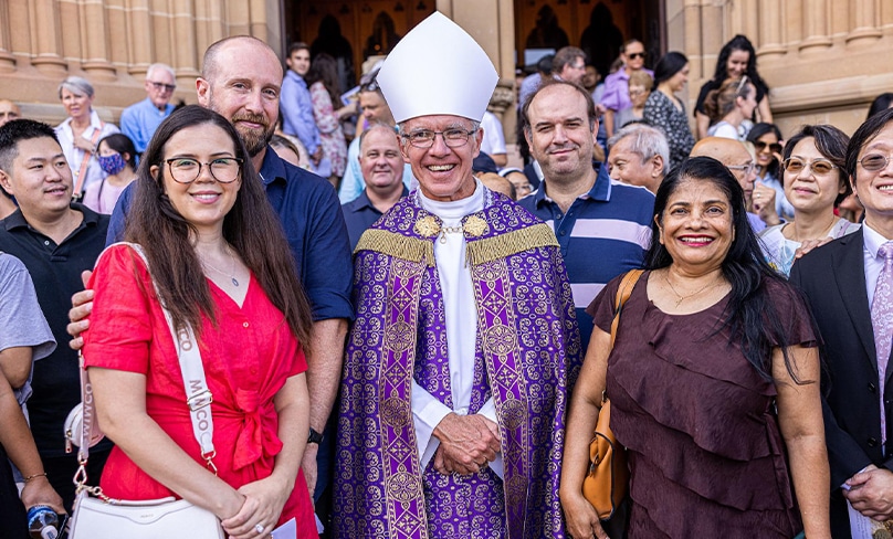 Police officer Nathan Kohutek, pictured at left of Bishop Daniel Meagher, with wife Lucy Kohutek was one of the new Catholics that attended the celebration. Photo: Alphonsus Fok