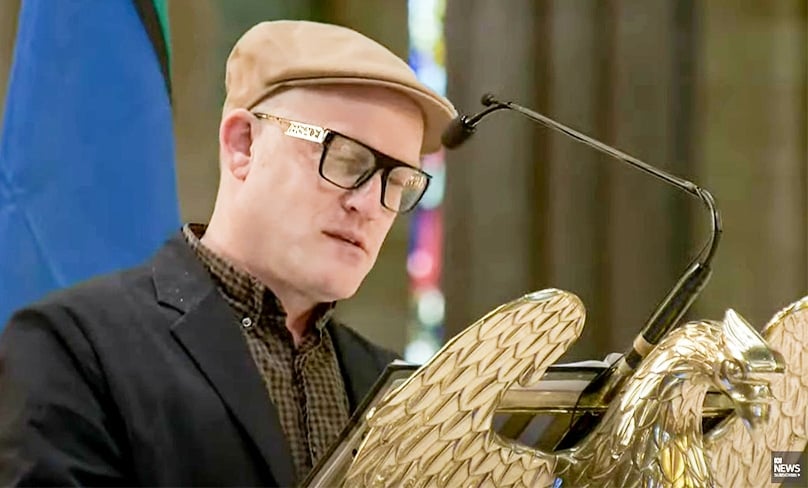 Comedian and writer John Safran, a friend and media collaborator of Fr Bob Maguire, speaks at the state funeral for Fr Bob in St Patrick’s Cathedral, Melbourne on 5 May. Photo: Youtube/ABC