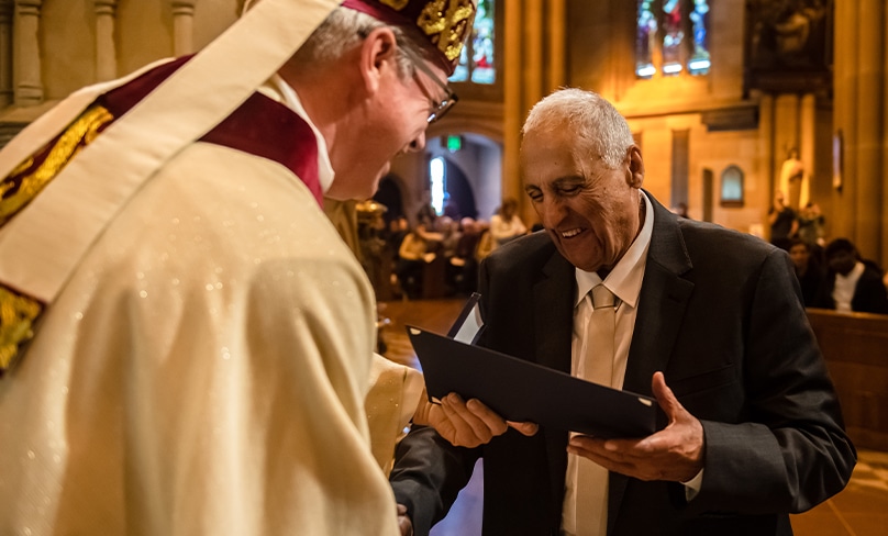 Arthur Doumit, St Vincent de Paul's Society's acting regional president for the Liverpool conference, receives his medal for a lifetime of service through his pastoral outreach, particularly through Vinnies. Photo: Giovanni Portelli