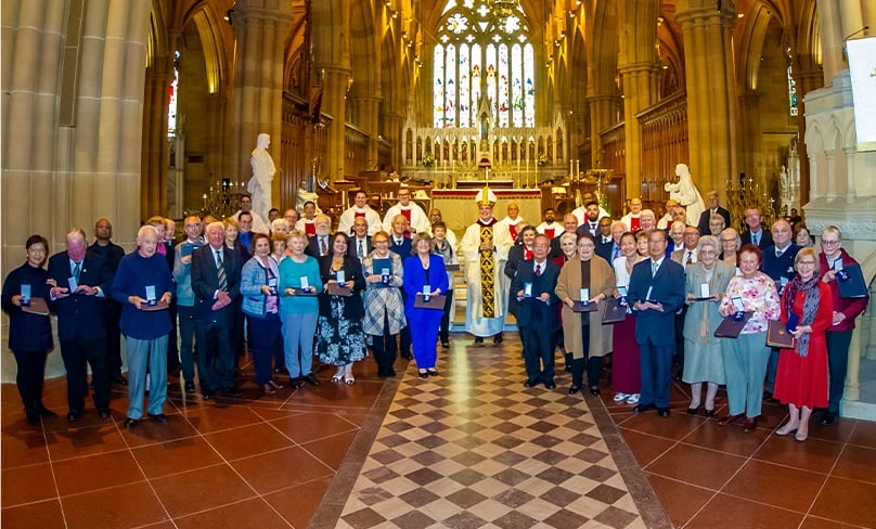 The group of 51 Catholics were awarded a Dempsey medal for outstanding service in the Archdiocese of Sydney by Bishop Richard Umbers during a Solemn Mass at St Mary’s Cathedral. Photo: Giovanni Portelli