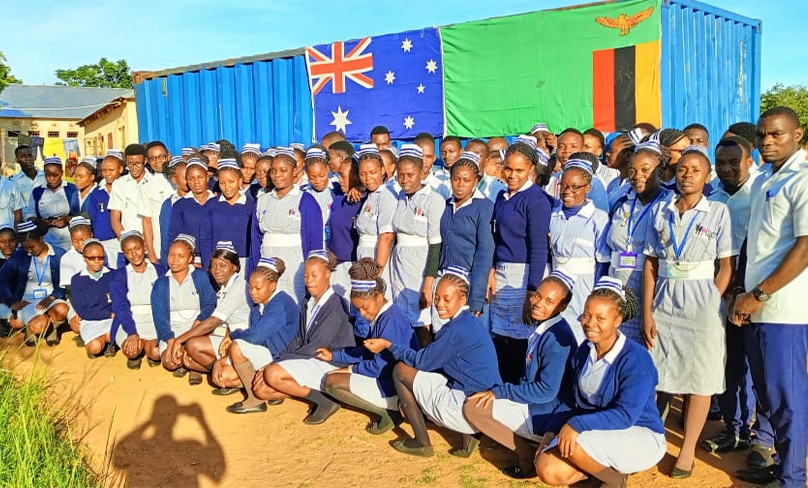 Students at the St Joseph Lumezi Nursing College welcome a donation of medical supplies and textbooks from Sydney supporters, led by Dr Mark Hanley. Photo: Supplied