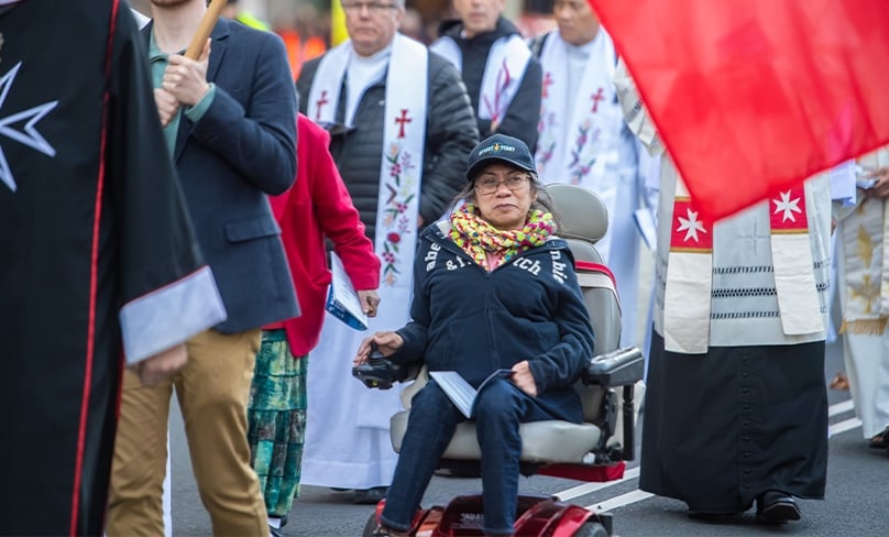 During the recent Walk with Christ through the streets of Sydney, Teresa Trujillo could be seen at the front of the Corpus Christi procession, wheeling with Christ. Photo: Giovanni Portelli