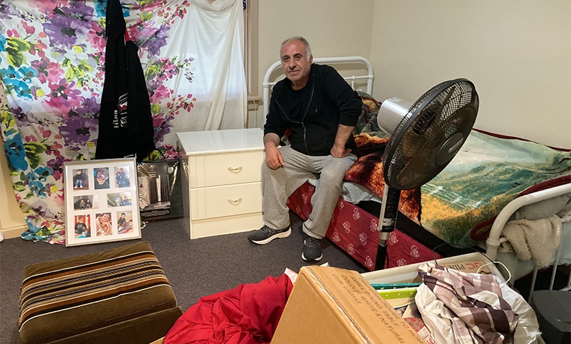 Sam Ali with his furniture which was delivered by Tony Cranney to his emergency housing. Photo: Supplied
