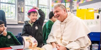 Archbishop Anthoyn Fisher OP with students at St Felix Catholic Primary School, Bankstown. Photo: Giovanni Portelli