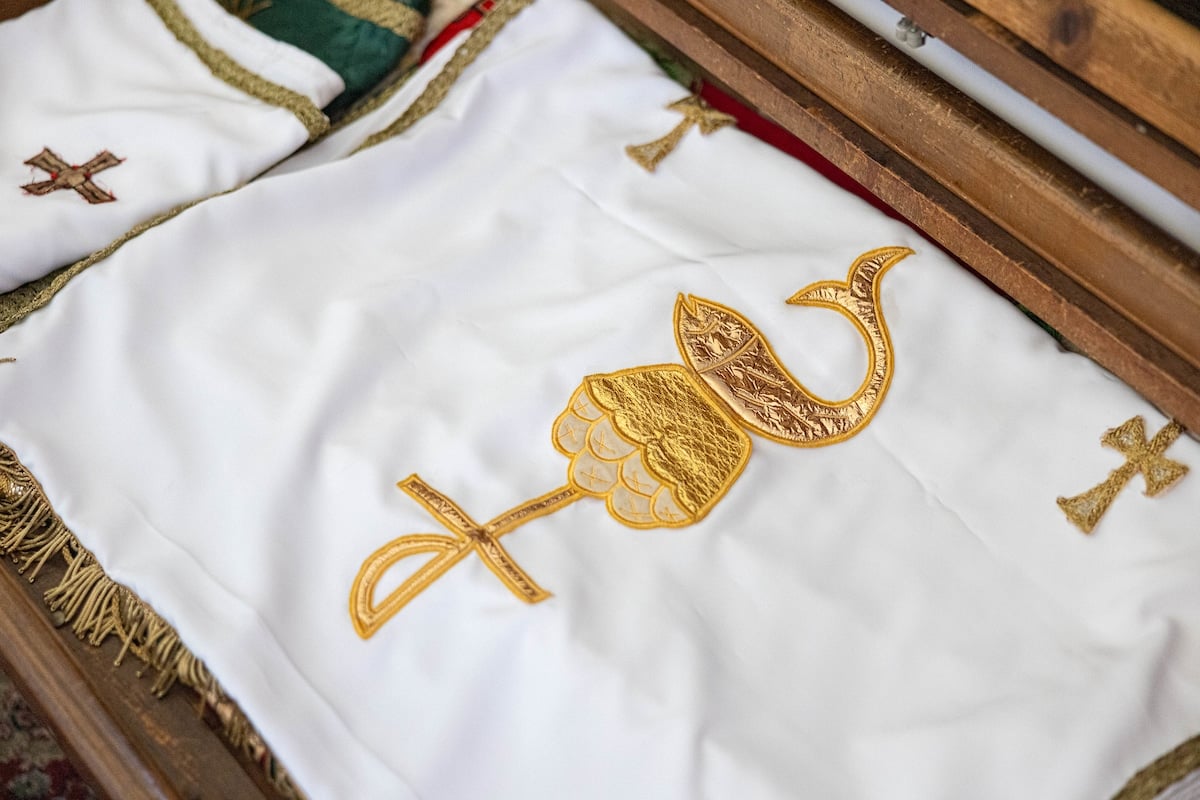 A deft seamstress, Florence Grech not only washes the altar linens and vestments, but repairs and makes new ones as needed. Photo: Alphonsus Fok