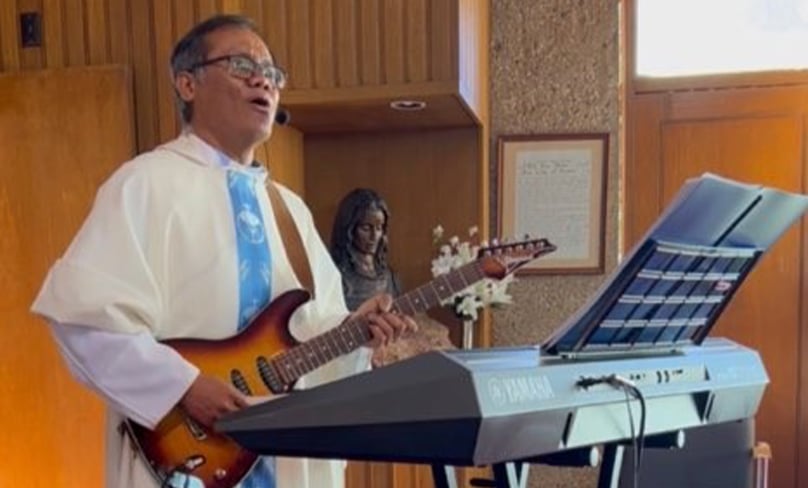 Fr Oche Matutina CSsR, affectionately known as Fr Rock’n’Roll, is “strumming up” parishioners from all over the diocese of Wilcannia-Forbes and beyond. Photo: Supplied