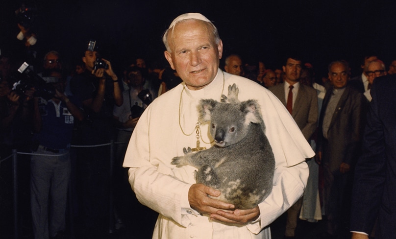Pope John Paul II holds a koala during his 1986 visit to Australia. Photo: CNS/L’Osservatore Romano