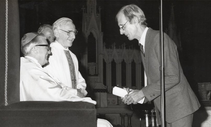 Cliff Baxter is pictured receiving a citation from Cardinal Clancy for his reporting. Photo: CW/Supplied