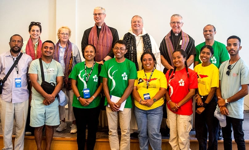 Bus Leader Jessica Nohra, Sydney Archdiocese director of chancery projects Kathy Campbell, Bishop Richard Umbers, Archbishop Anthony Fisher OP, Bishop Daniel Meagher with pilgrims from Timor-Leste who were sponsored by the Archiocese of Sydney. Photo: Mathew De Sousa