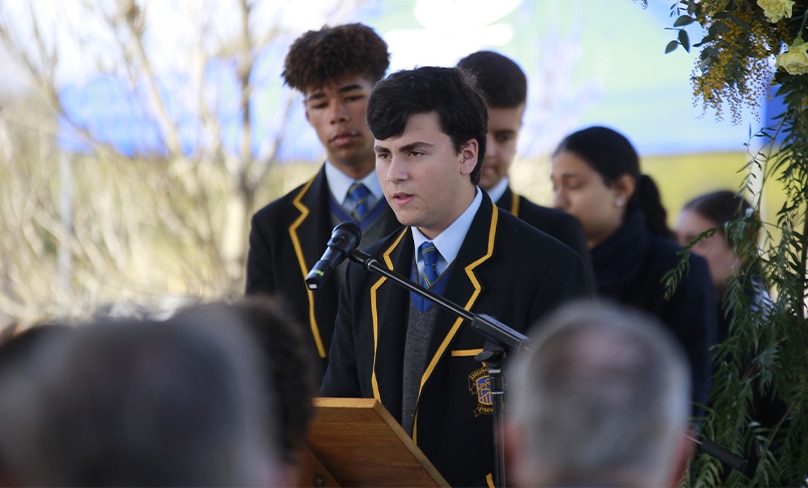 Students from St Patrick's College, Strathfield, participate in the interment service. Photo: Supplied