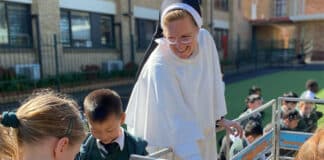 Sr. Cecilia Joseph, OP woth students at St. Peter Chanel Catholic Primary School in Regents Park. Photo: Supplied