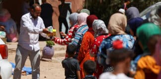 Women and children receive aid in Tinmel, Morocco, 11 September, in the aftermath of a deadly 6.8 magnitude earthquake Sept. 8, which has claimed the lives of thousands and left thousands of others homeless. Photo: OSV News photo/Hannah McKay, Reuters