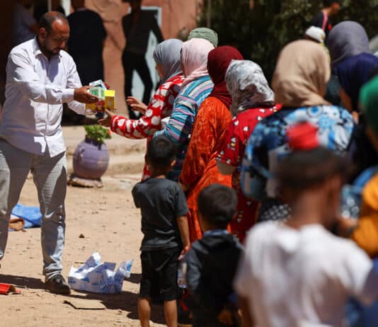 Women and children receive aid in Tinmel, Morocco, 11 September, in the aftermath of a deadly 6.8 magnitude earthquake Sept. 8, which has claimed the lives of thousands and left thousands of others homeless. Photo: OSV News photo/Hannah McKay, Reuters