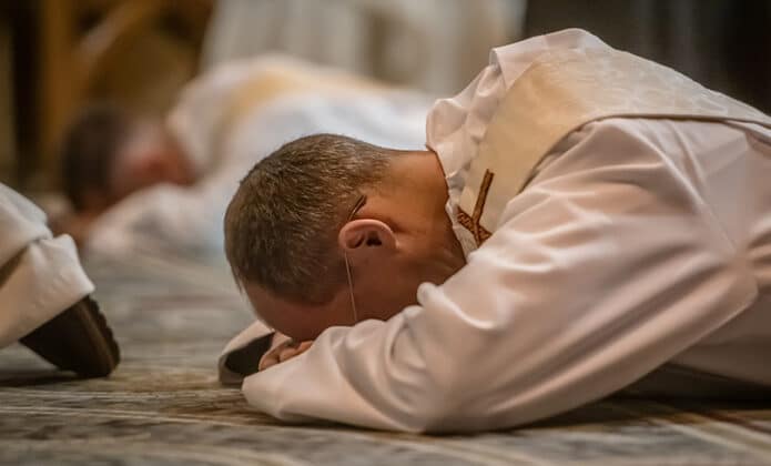 Rev. Richard Sofatzis and Matthew Lukaszewicz lay prostrate during their Ordination to the Priesthood at St Mary’s Basilica, Sydney, 9 September 2023. Photo: Giovanni Portelli