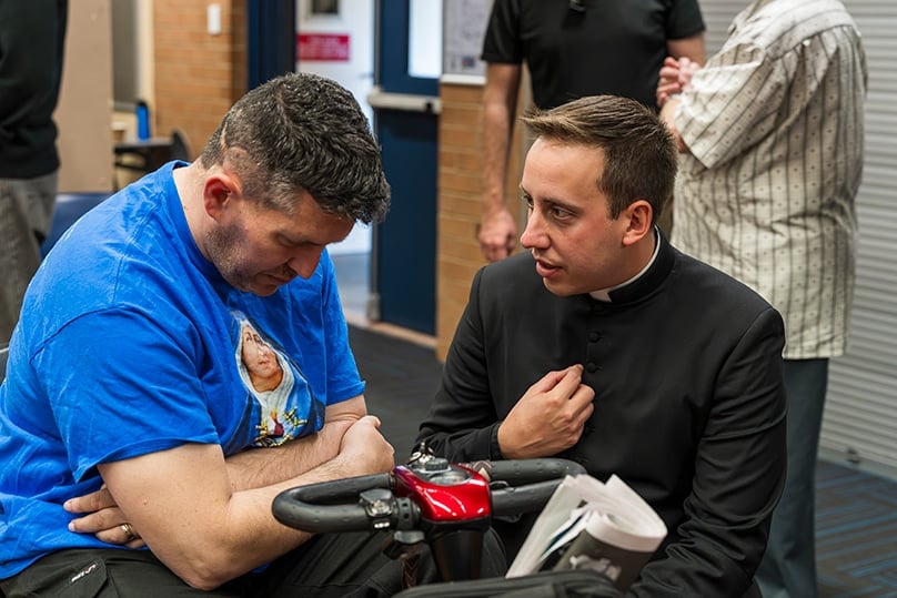 Fr Daniele Russo, the archdiocese’s vocations director, pitctured with one of the attendees, gave a keynote on the importance of keeping the Sabbath holy. Photo: Patrick J Lee