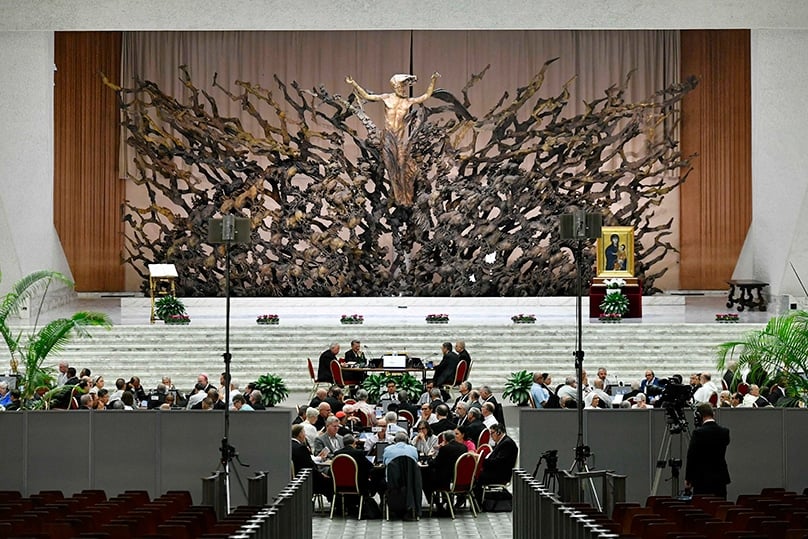 Participants at the assembly of the Synod of Bishops recite morning prayer before finishing their discussions on the assembly's first module, which was on the meaning of synodality and how to promote it in the church, in the Vatican's Paul VI Audience Hall 7 October 2023. Photo: CNS photo/Vatican Media
