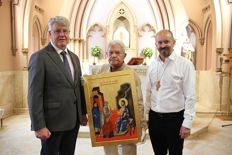 Archdiocesan Chancellor Christopher Meney with artist Michael Galovic and Fr Paul Smithers. Photo: Adam Wesselinoff