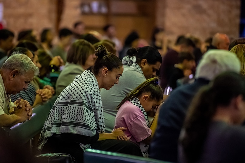 Australian Palestinians attend Mass to pray for peace in their homeland at Holy Name of Mary Church in Rydalmere, on 18 October. Photo: Giovanni Portelli