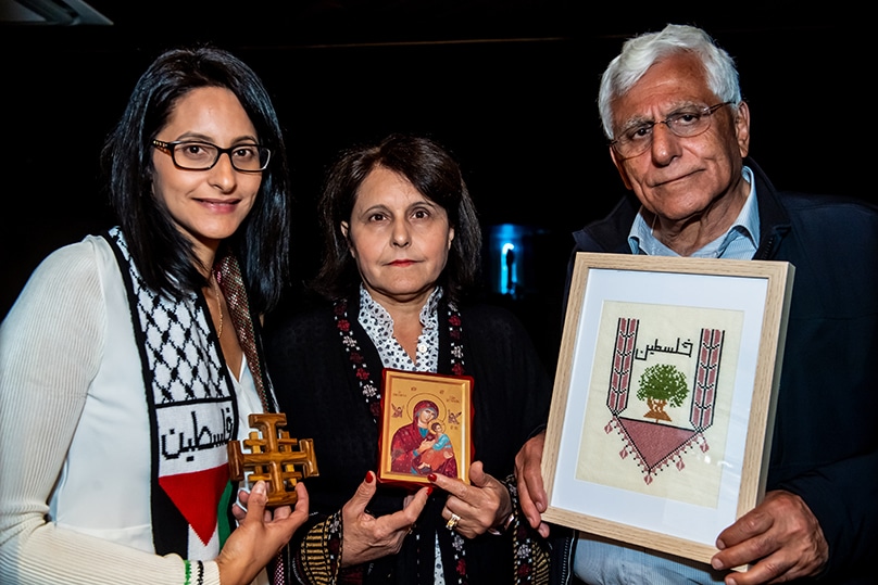 Mary (centre) with her husband Henry and daughter Nahil joined other Australian Palestinians at Holy Name of Mary Church in Rydalmere, for a Mass to pray for peace in their homeland on 18 October. Photo: Giovanni Portelli