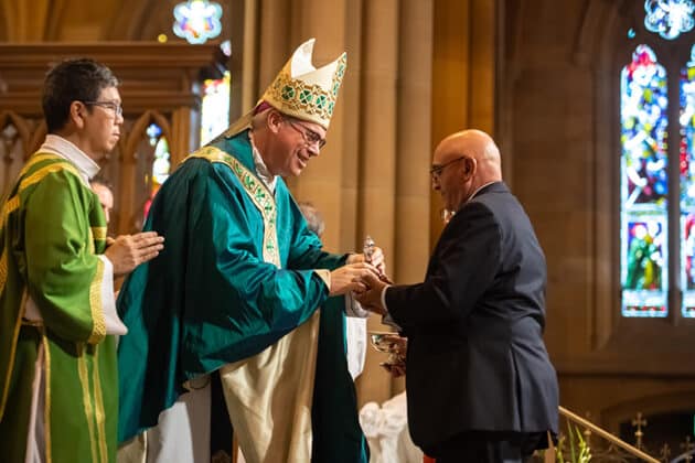 Bishop Richard Umbers presented married couples with a certificate to celebrate their love for each other. Photo: Giovanni Portelli